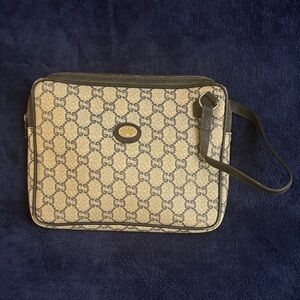 Authentic Gucci plus Beige and Black Monogram Pouch.